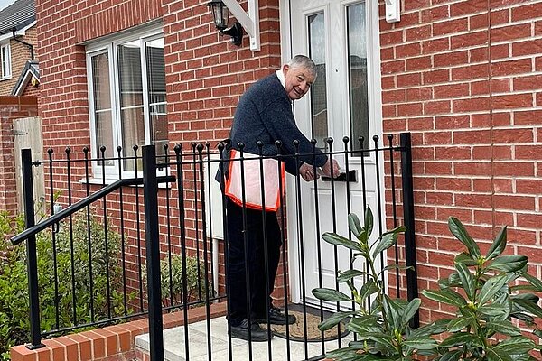 Gerald delivering G/E campaign leaflet